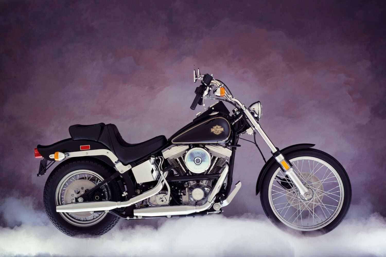 a motorcycle parked in the clouds - Harley-Davidson FXST Softail 1984