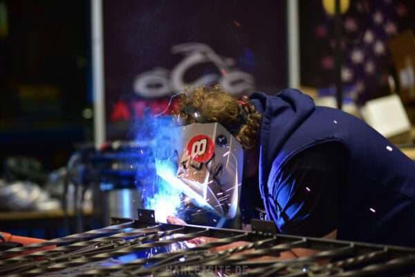 a man welding a metal object