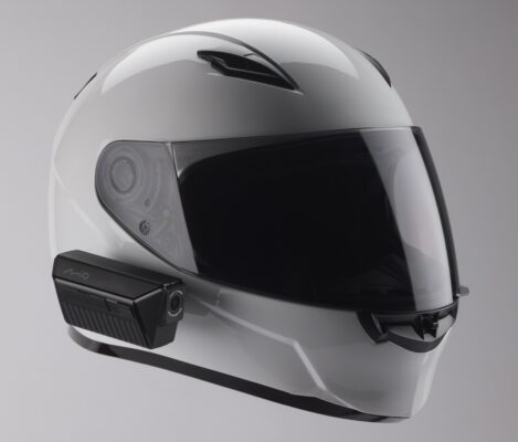 a white motorcycle helmet with a video camera