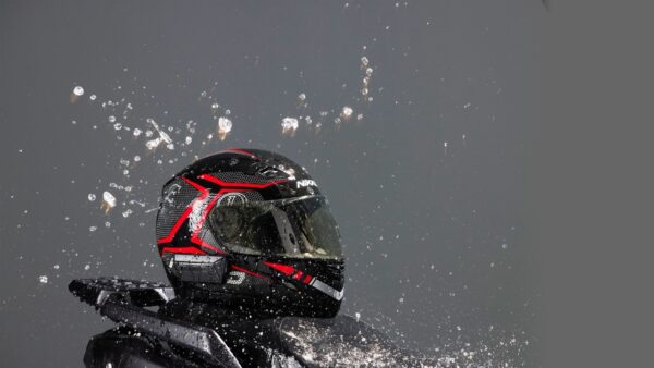 a person wearing a helmet splashing water